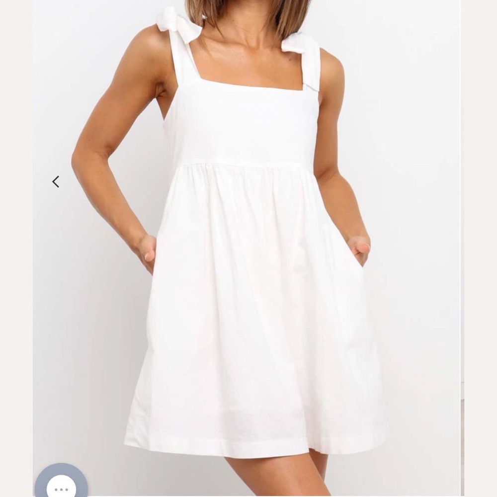 Petal and Pup “Hurner Dress” is a white with tie straps and pockets.